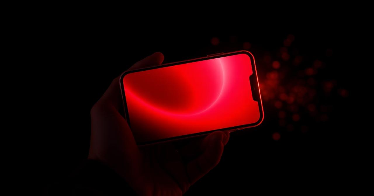 Smartphone met een rood gloeiend casino-scherm in een donkere omgeving